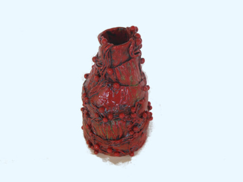 Red Bottle with strings and balls top
